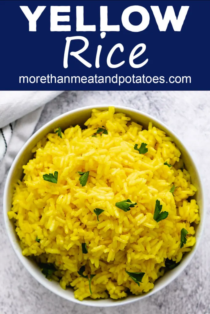 Top down view yellow rice with parsley.