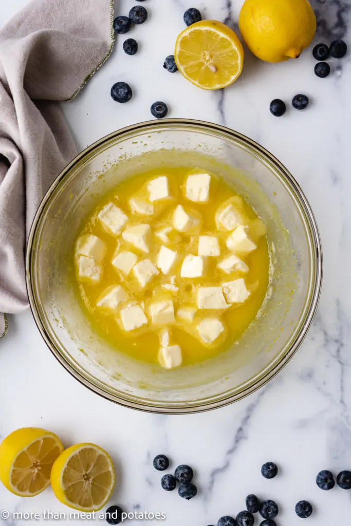 Butter cubes added to lemon curd mixture.