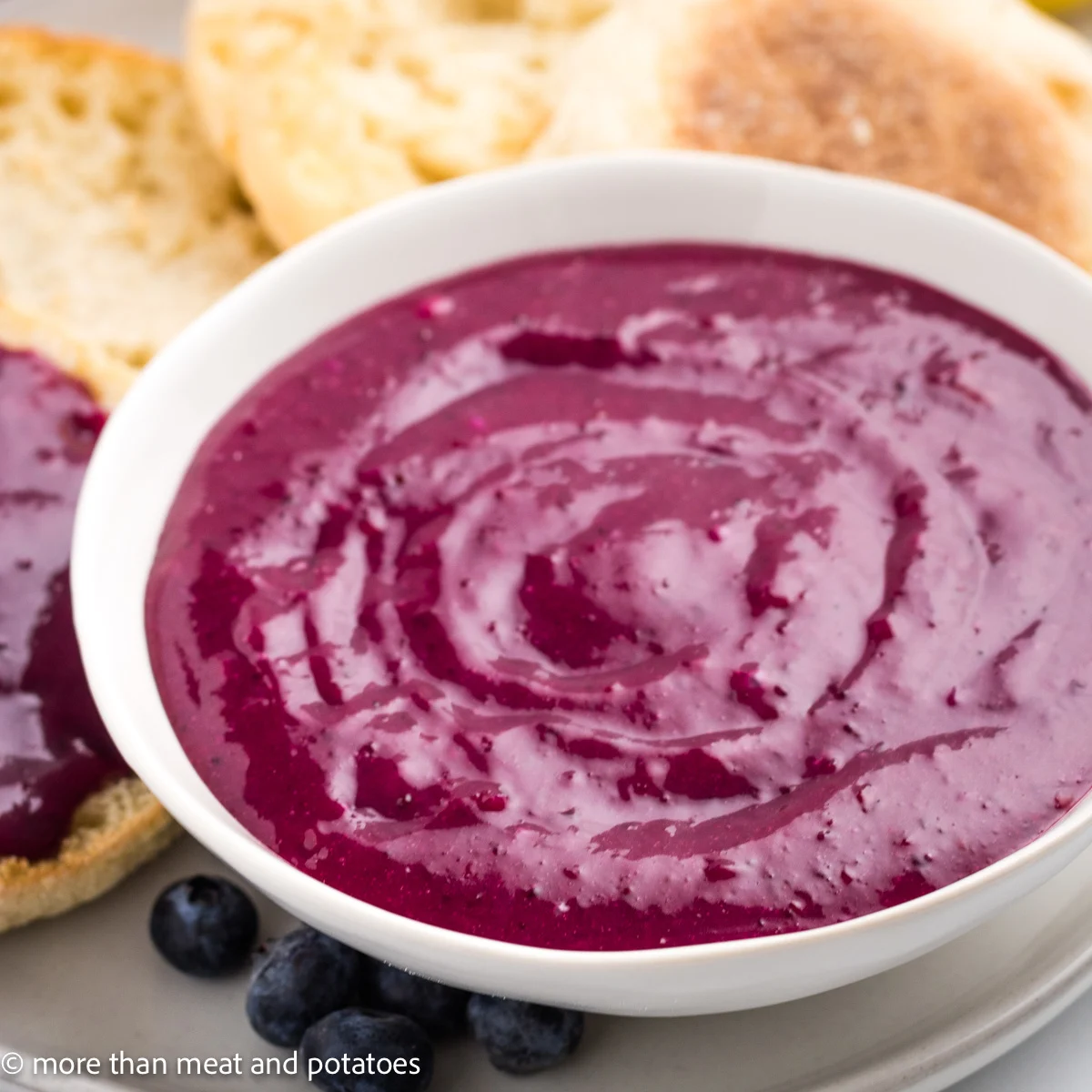 Close up view of fruit curd with bread.