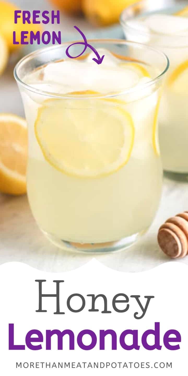 Glass of honey lemonade with fresh lemon slices.