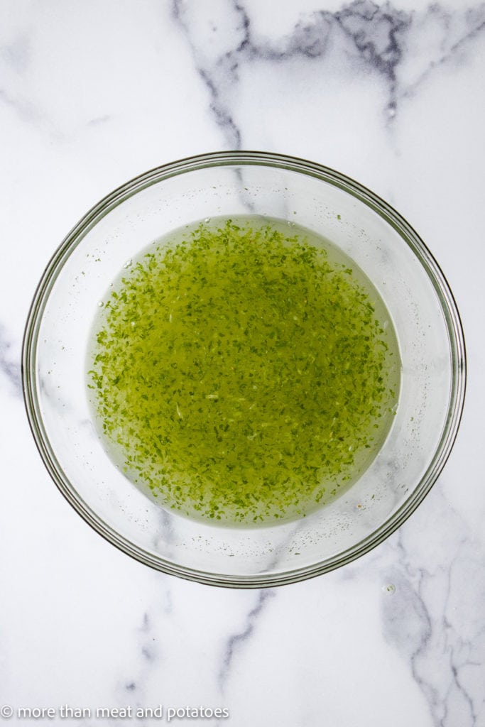 Lime juice, lime zest, and sugar in a bowl.