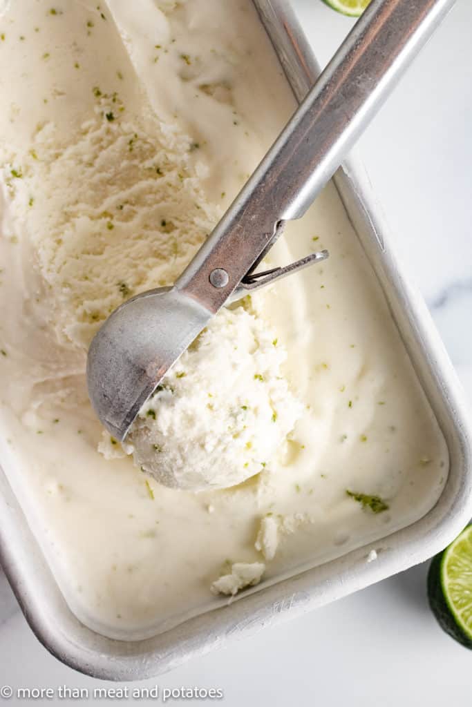 Top down view of lime ice cream in a pan.