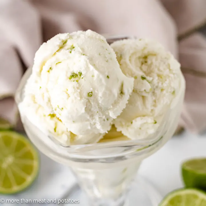 Top down view lime sherbet in a glass dish.