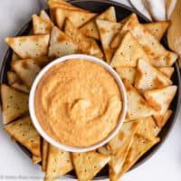 Top down view of roasted red pepper dip on a serving plate.