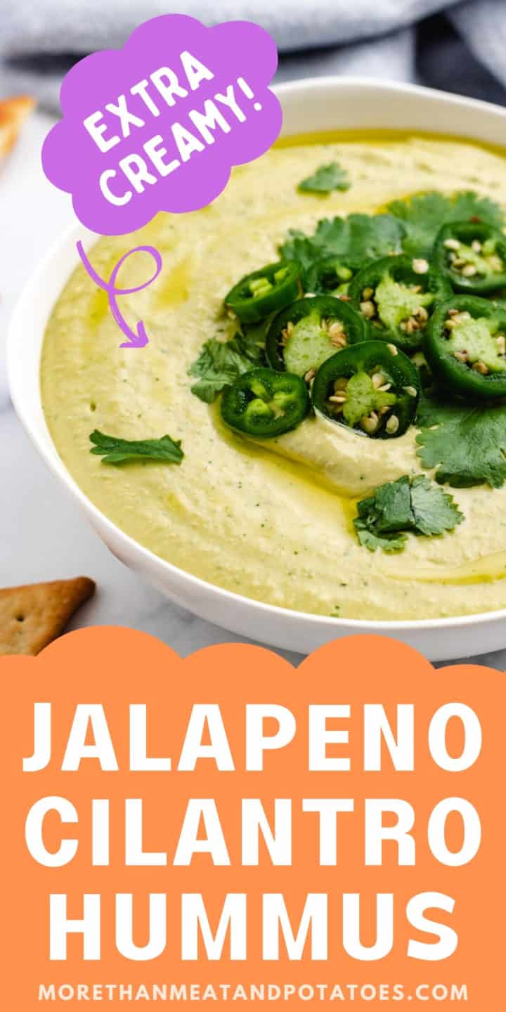 Large bowl of hummus topped with jalapenos and cilantro.