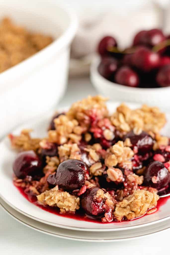 Close up view of cherry crisp on a plate.