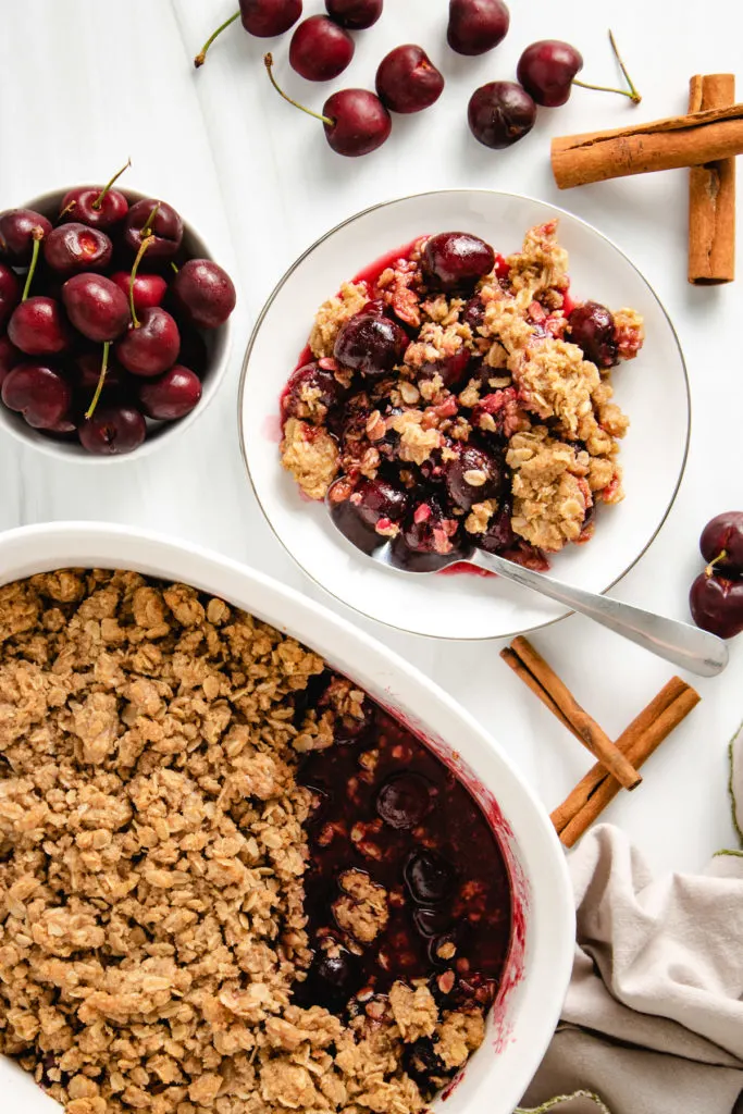 Top down view of a baking dish filled with cherry crisp.