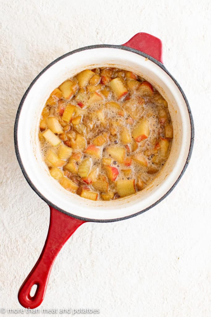 Top down view of rhubarb bowling in a pan.