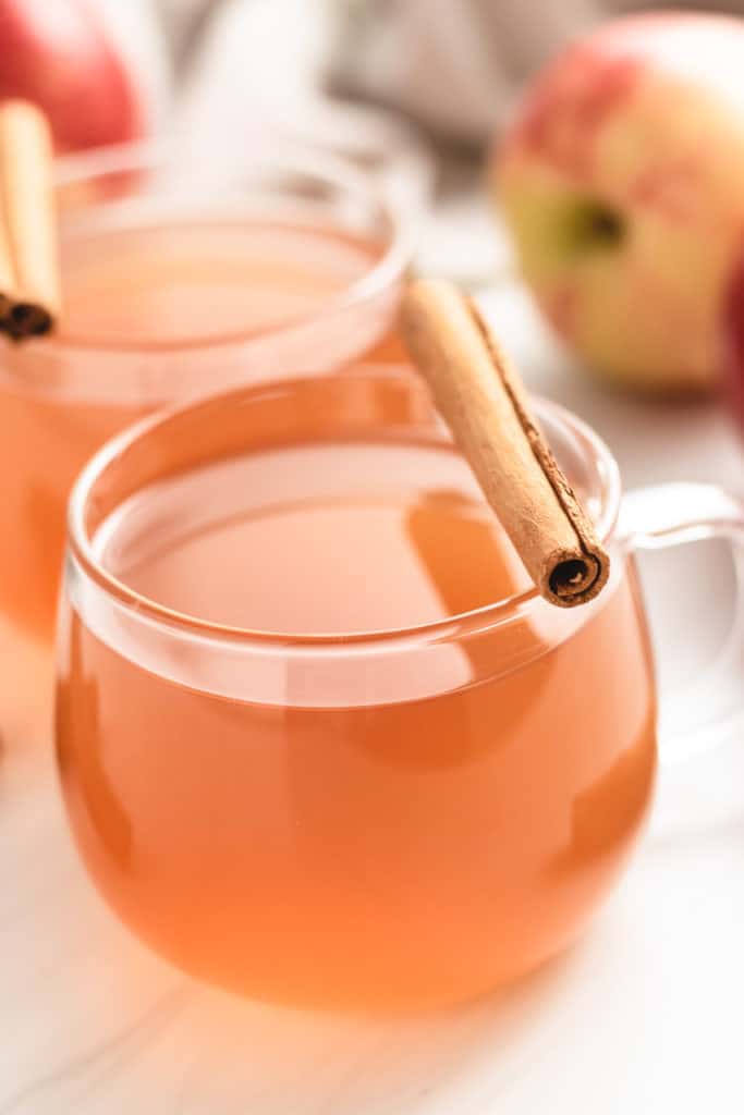 Apple cider in a glass mugh.