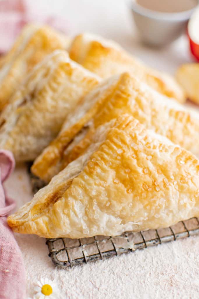 Several apple turnovers stacked against each other.
