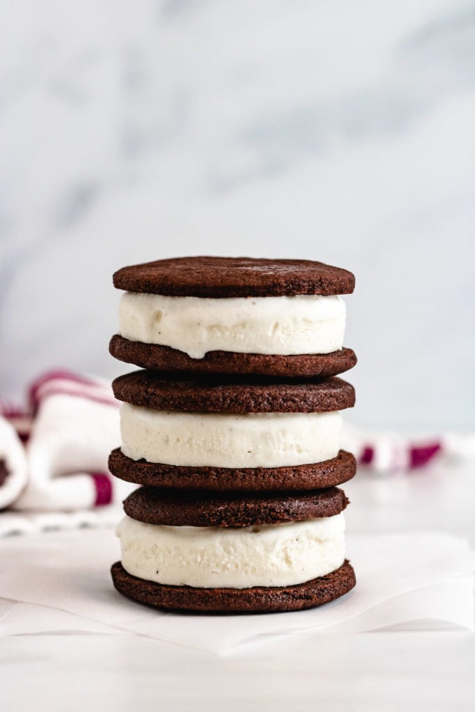 Three ice cream sandwiches stacked on top of one another.