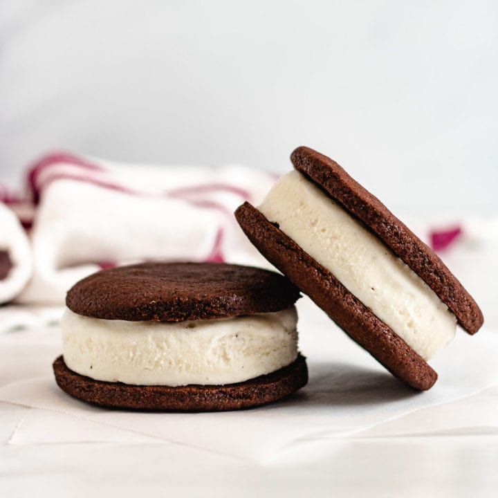 Two ice cream sandwiches next to each other.