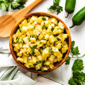 Top down view of jalapeno salsa with diced pineapple.