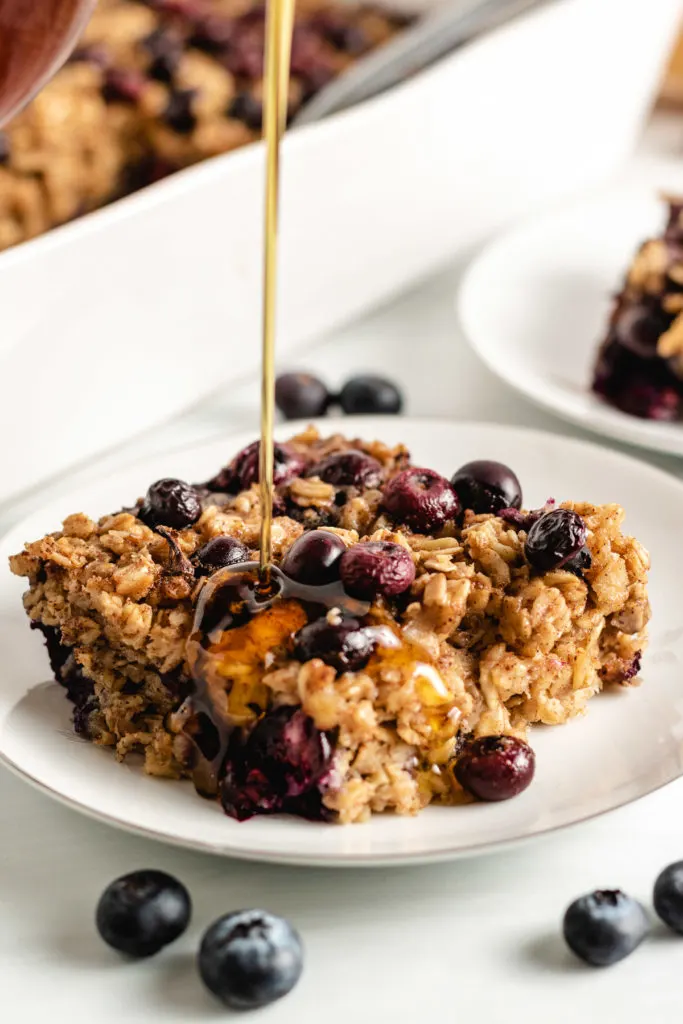 Baked oatmeal with syrup on a plate.