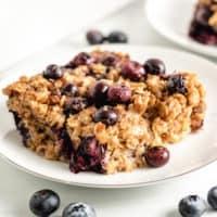 Baked blueberry oatmeal on a plate.