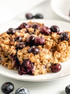 Baked blueberry oatmeal on a plate.