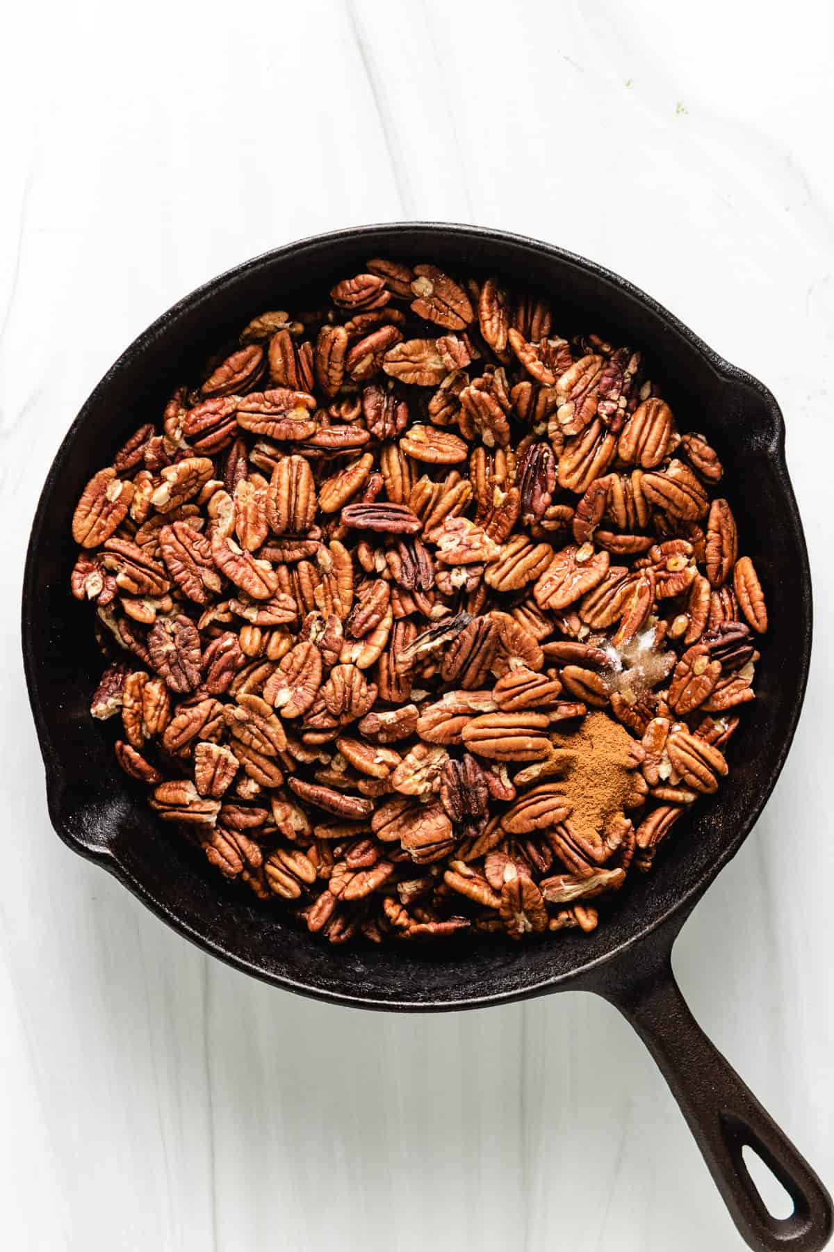Pecan halves with maple syrup and cinnamon.