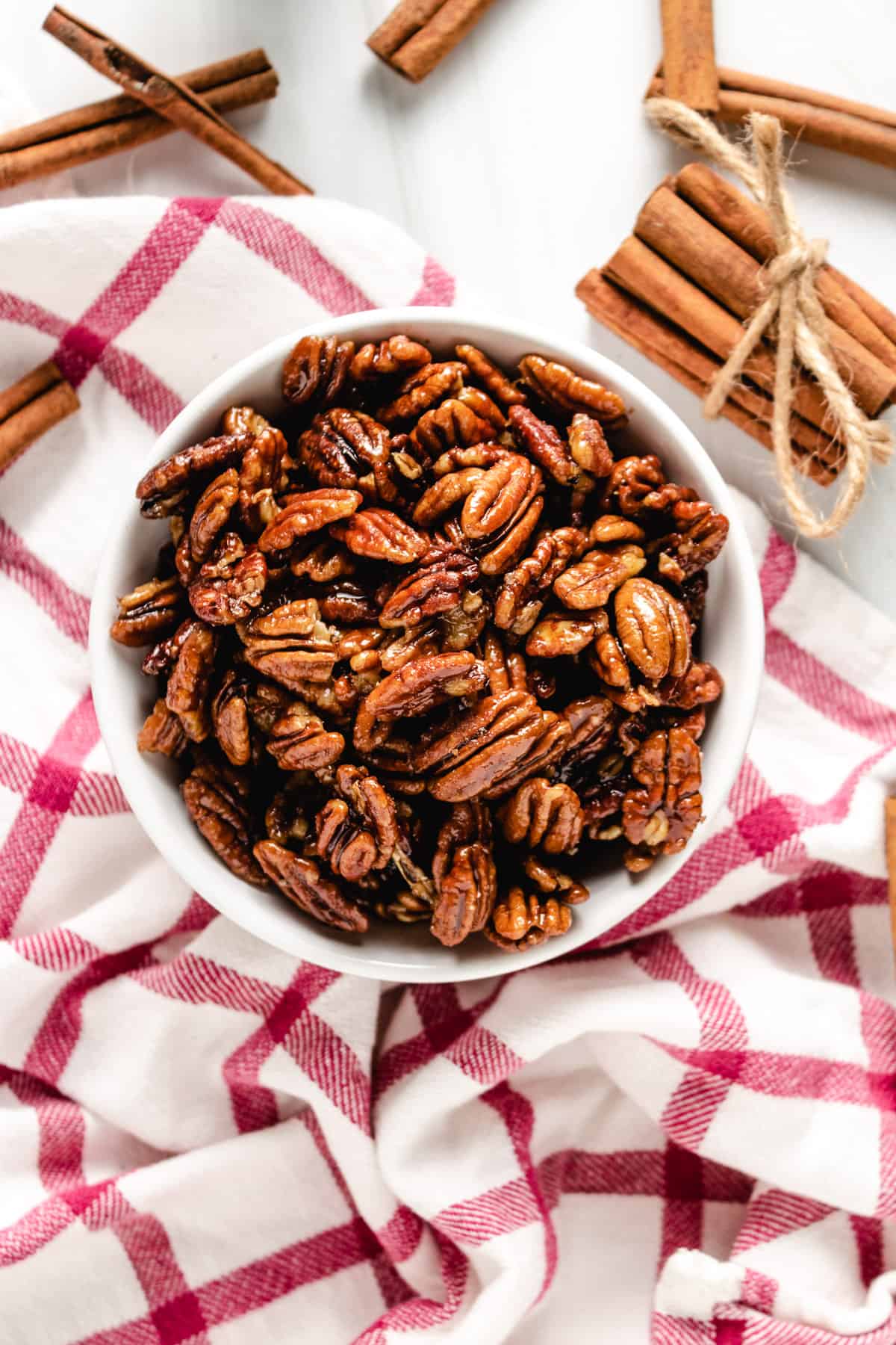 Top down view of a bowl of candied pecans.