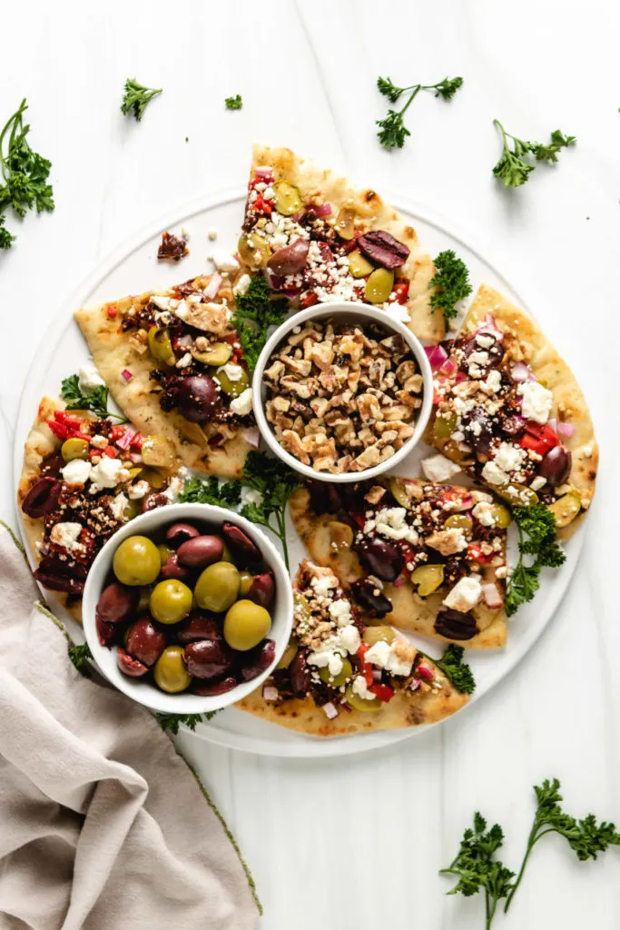 Top down view of slices of greek bread on a platter.