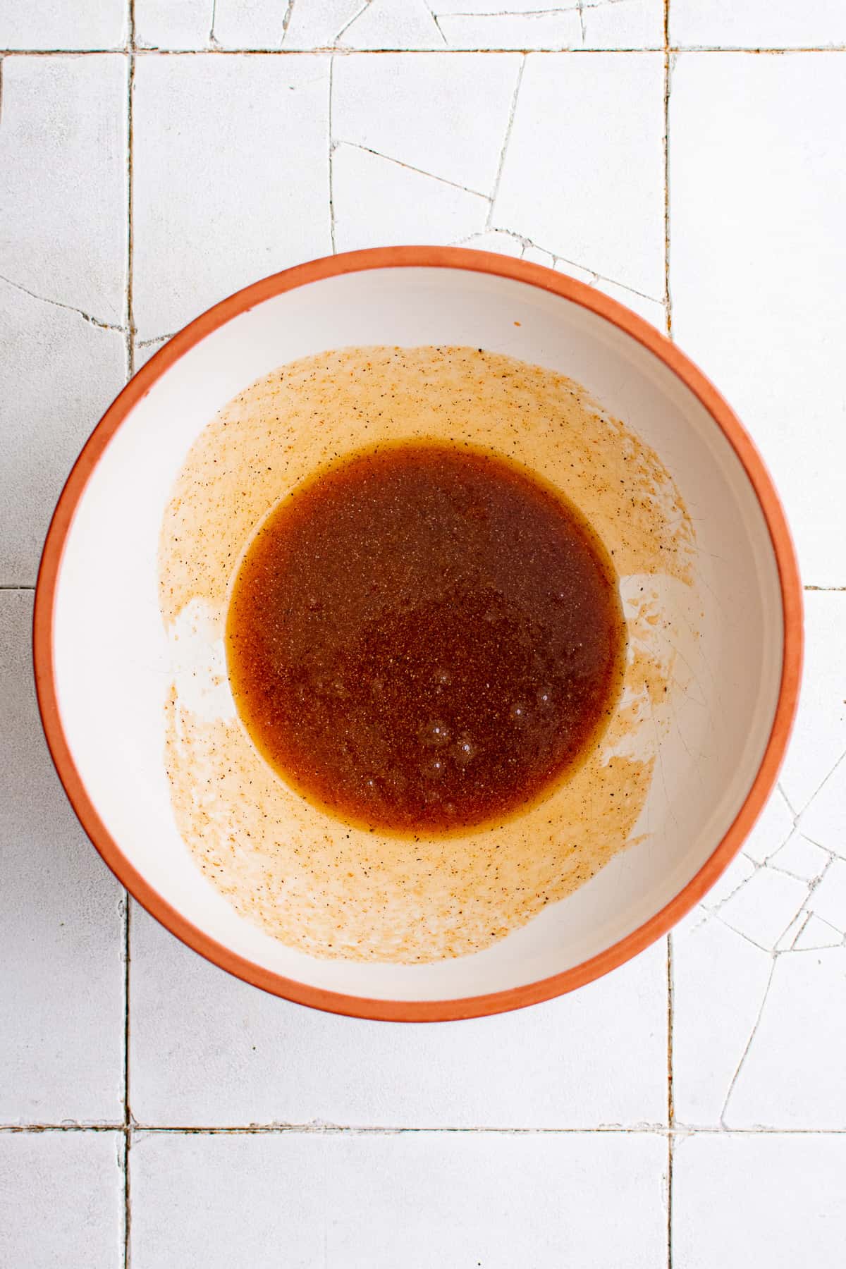 Top down view of honey sriracha mixture in a bowl.