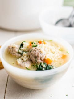 Small bowl of soup with meatballs.