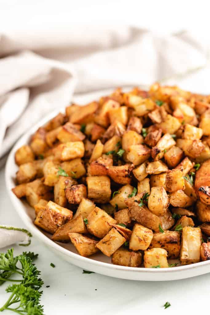 Close of view of potatoes on a gray dish.