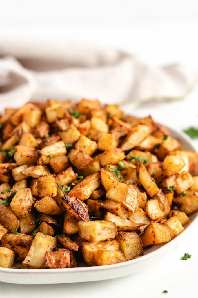 Roasted potatoes on a serving plate.