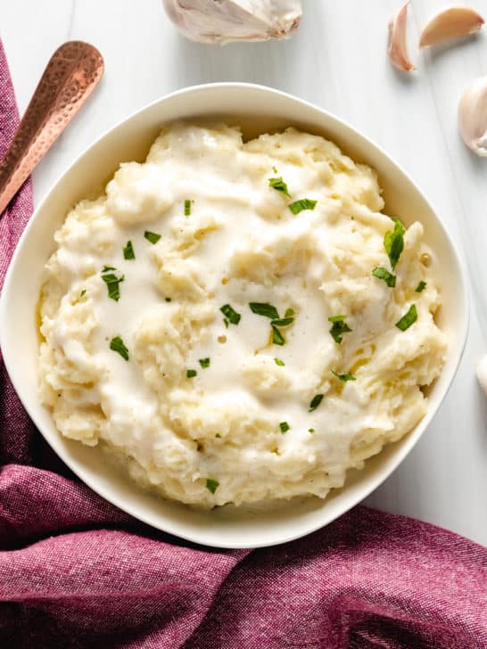 Top down view of a big bowl of mashed potatoes.