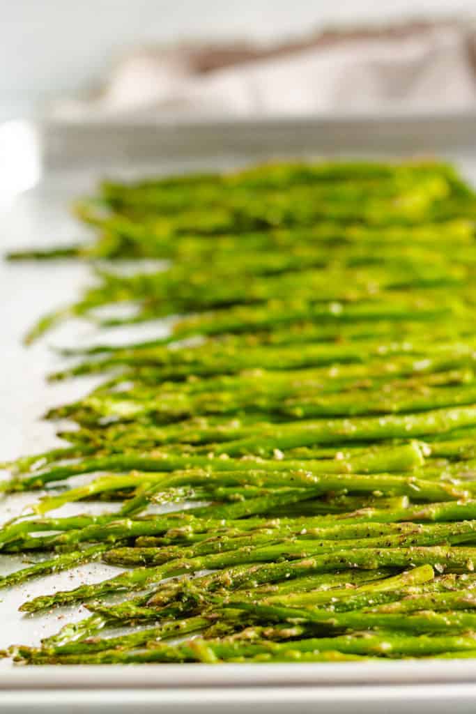 Roasted asparagus on a sheet pan.
