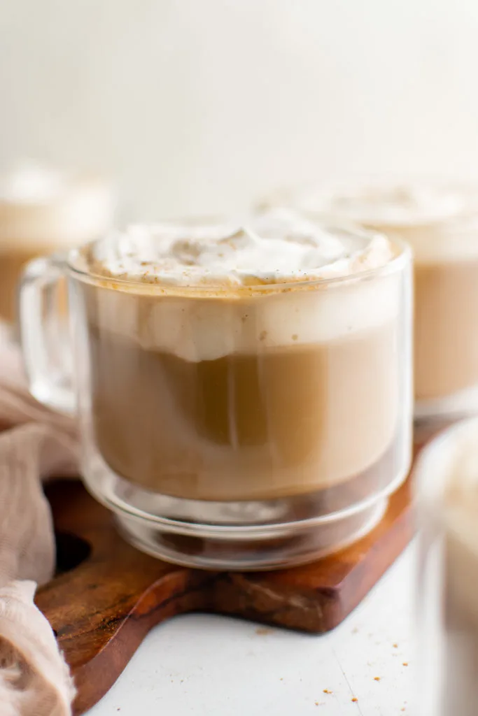 Glass mugs filled with latte.