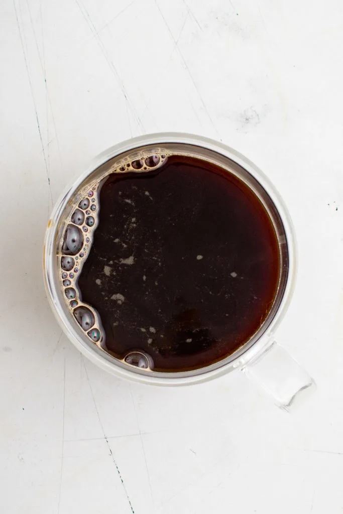 Top down view of coffee in a mug.