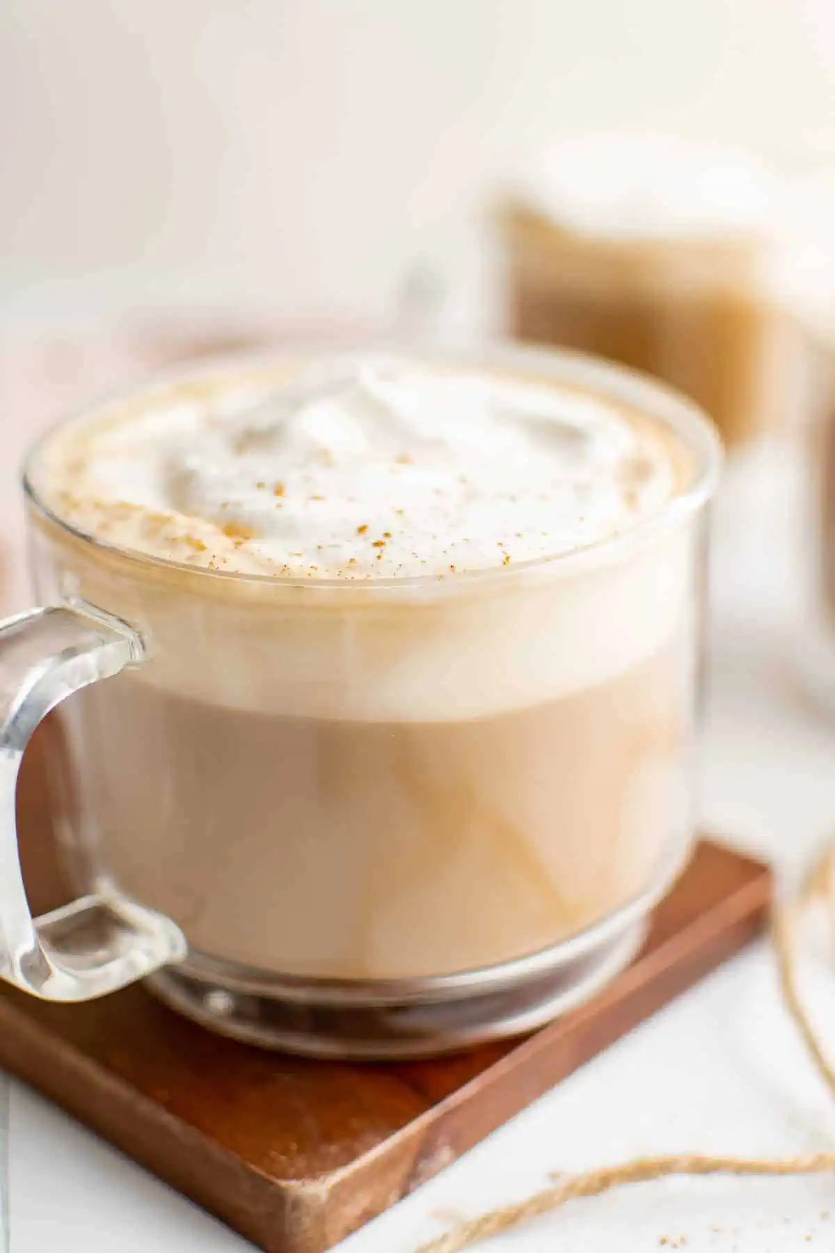 Large mug filled with lattes and whipped cream.