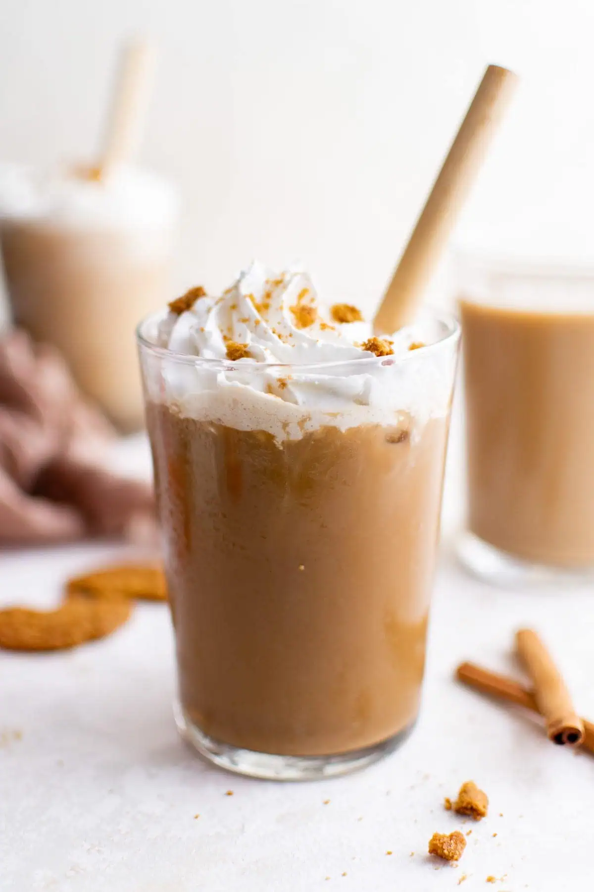 Cold gingerbread latte with a yellow straw.