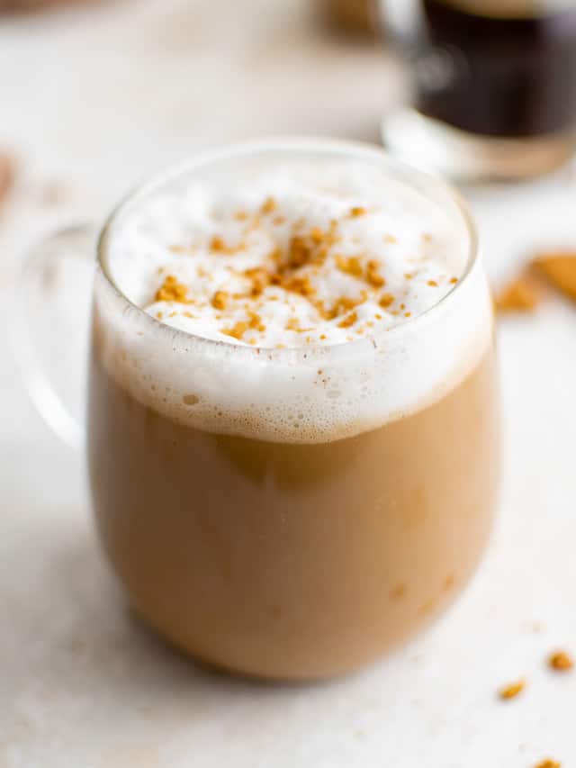 Glass mug filled with a hot gingerbread latte.