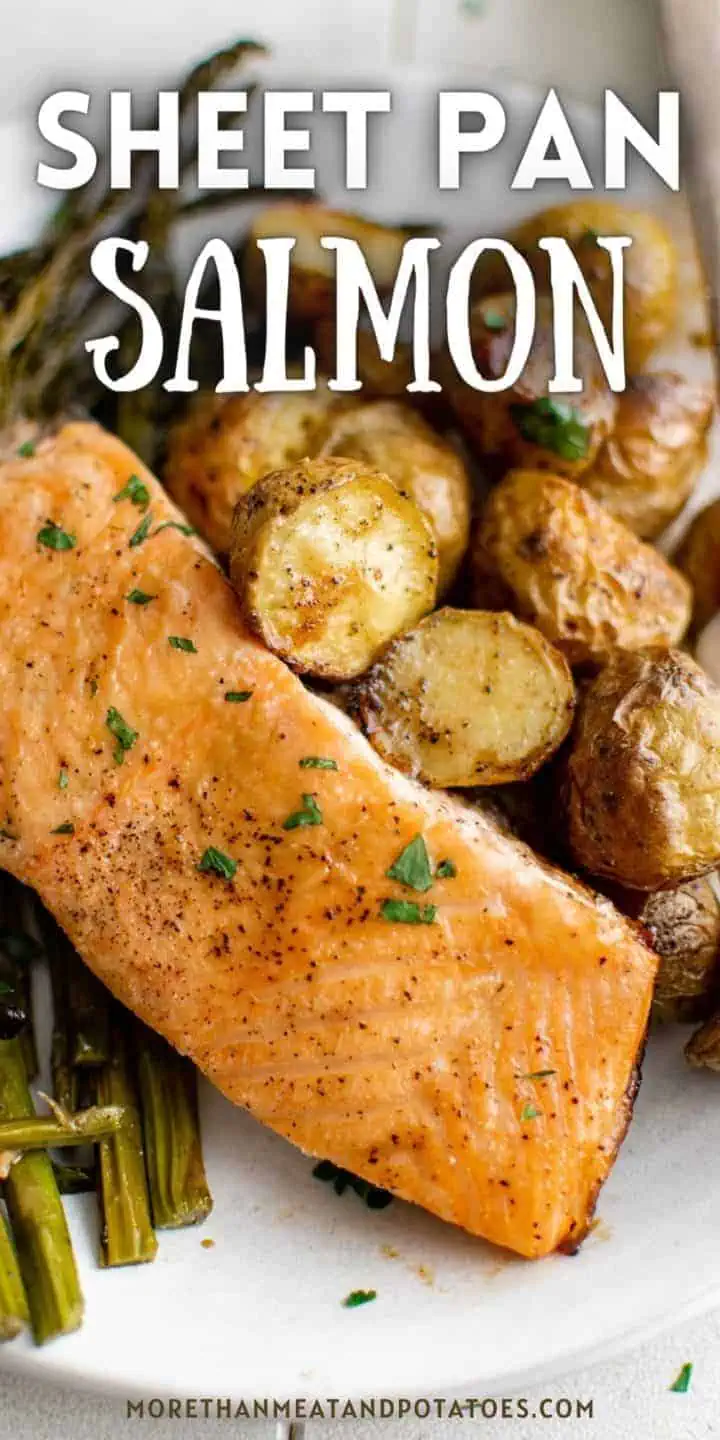 Close up view of a baked salmon fillet with potatoes.