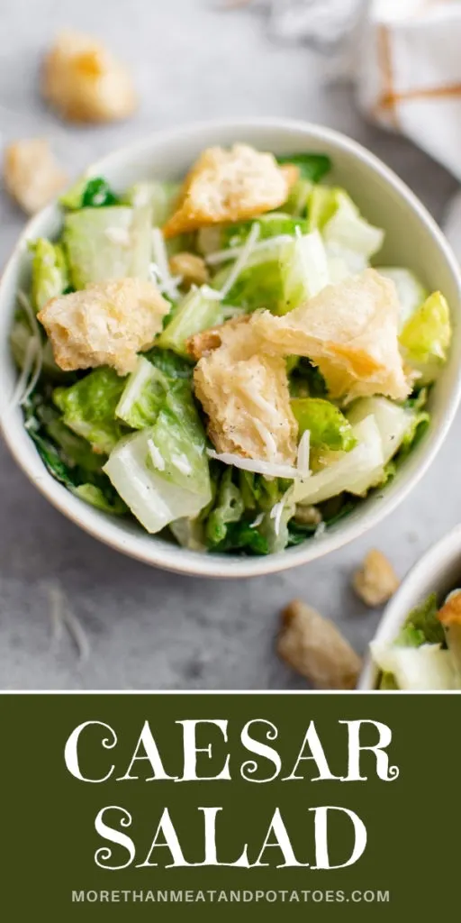 Close up view of a bowl of caesar salad.