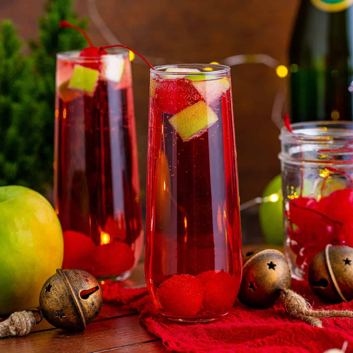 Display of Christmas mocktail with champagne and fruit.
