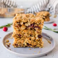Cranberry bars with crumble topping in a stack.