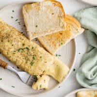 Fork taking a piece off of a french omelette.