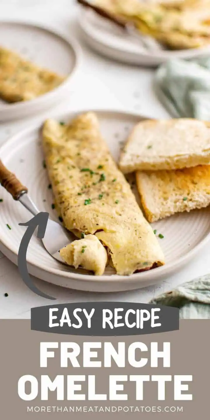 French omelette on a gray serving plate.