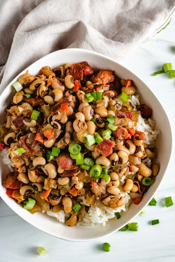 Top down view of a bowl of hoppin' john over rice.