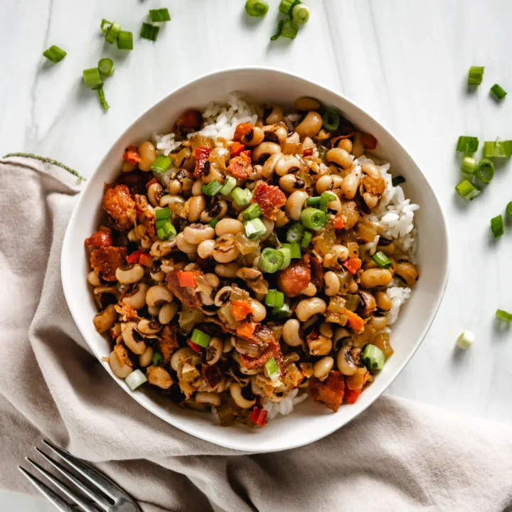 Top down view of hoppin john with green onions.