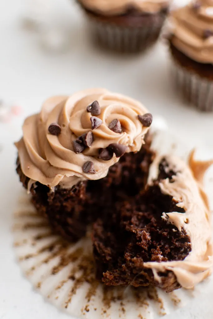 Hot chocolate cupcake with a bite taken out.