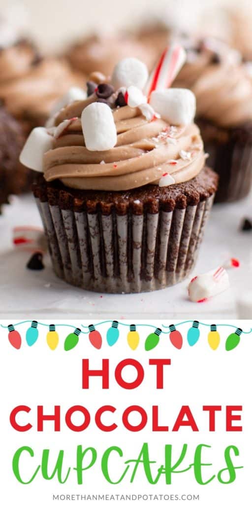 Close up of a hot chocolate cupcake with a peppermint stick.