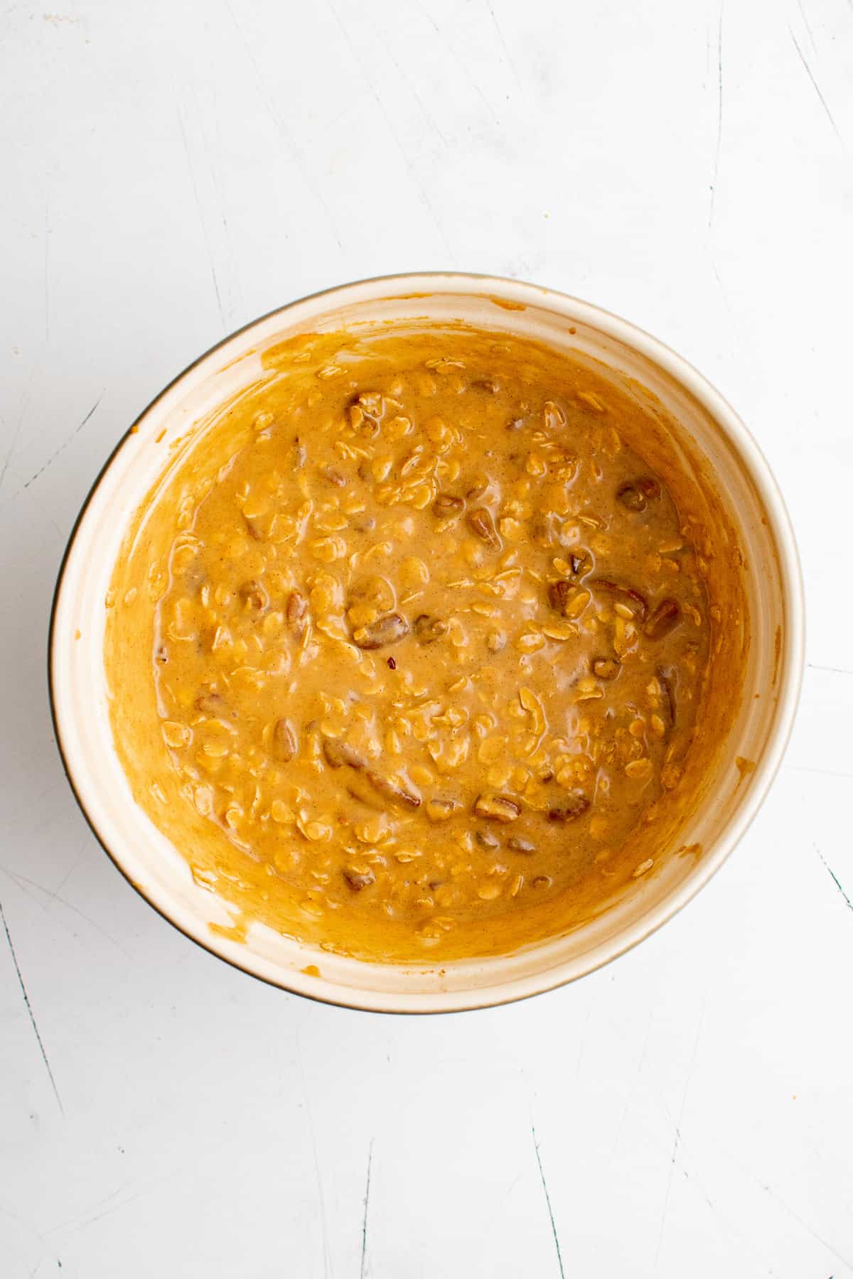 Pumpkin oatmeal batter in a mixing bowl.