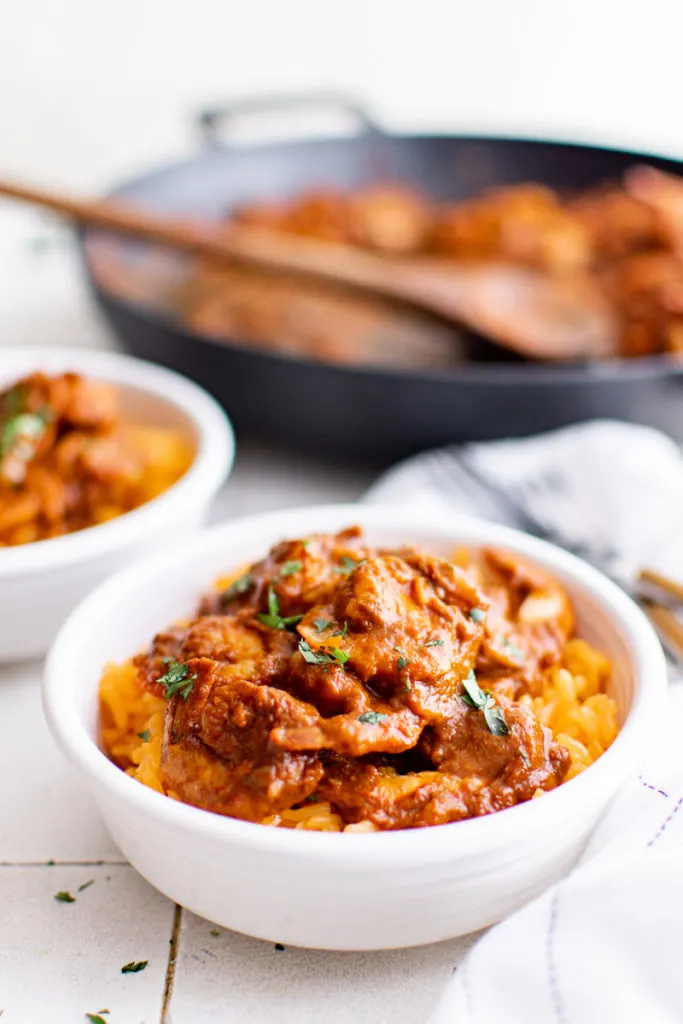 White serving bowls filled with shrimp diablo.