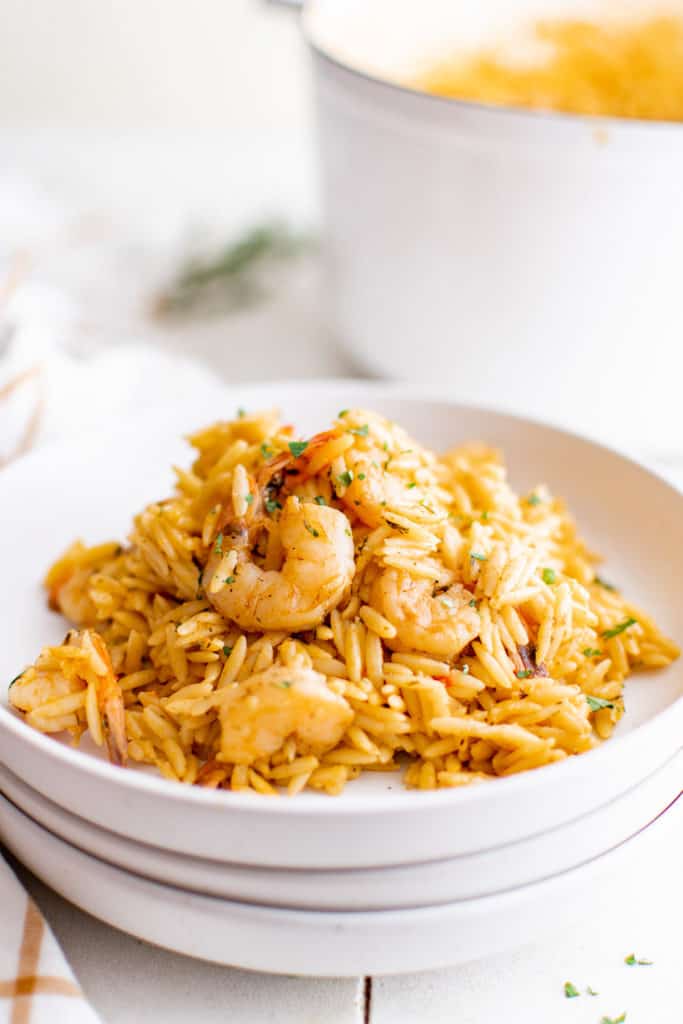 White dish with orzo and shrimp.