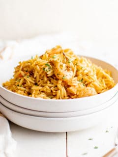 White bowl piled high with shrimp orzo.