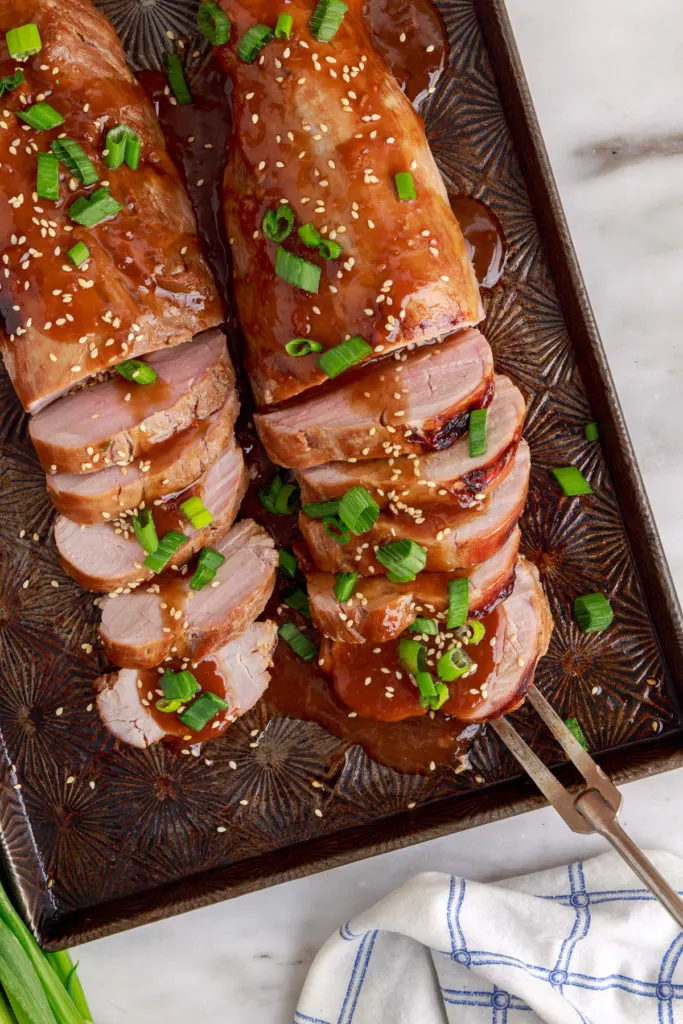 Teriyaki pork tenderloin on a baking sheet.