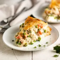 Small plate with a slice of chicken pot pie.